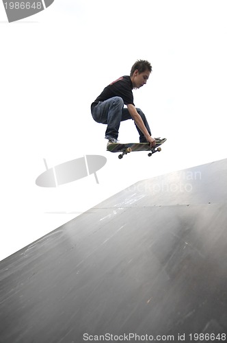 Image of Boy practicing skate in a skate park