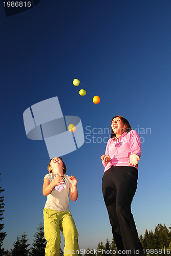 Image of Food balancing concept with girls in nature