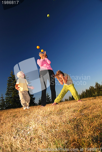 Image of Food balancing concept with girls in nature