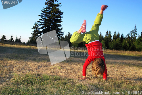 Image of Girl doing exercise in nature