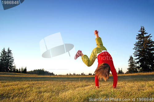 Image of Girl doing exercise in nature