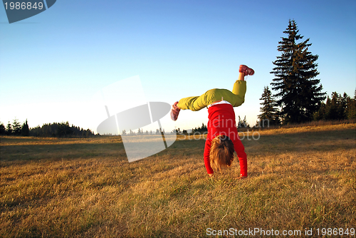 Image of Girl doing exercise in nature