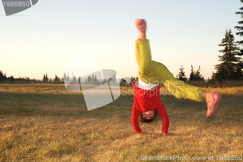 Image of Girl doing exercise in nature