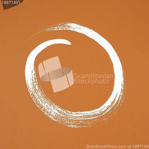 Image of White circle painted on orange background