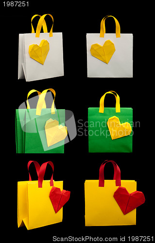 Image of Shopping bags with heart. Isolated origami