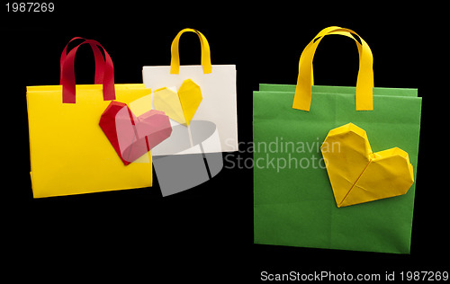 Image of Shopping bags with heart. Isolated origami