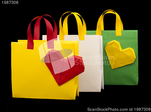 Image of Shopping bags with heart. Isolated origami