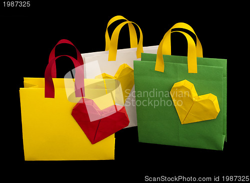 Image of Shopping bags with heart. Isolated origami