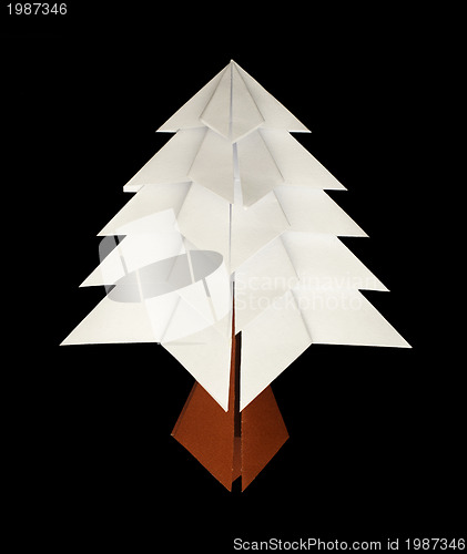 Image of White christmas tree made of paper. Origami evergreen tree