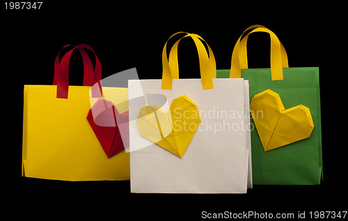 Image of Shopping bags with heart. Isolated origami