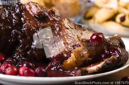 Image of Delicious Scrambled Grilled meat with cranberry sauce 