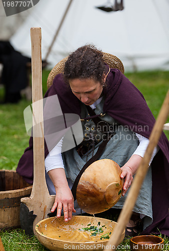 Image of Medieval Woman Washing the Dishes