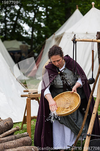 Image of Medieval Woman Washing the Dishes