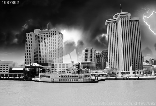 Image of Skyscrapers and Buildings over a Brown River