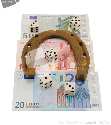 Image of retro horseshoe gamble dice euro banknote isolated 