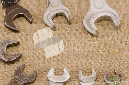 Image of set size wrench screw tools on linen background 