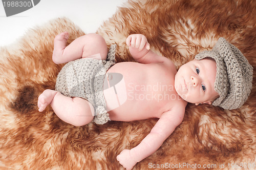 Image of Newborn baby in knitted wear