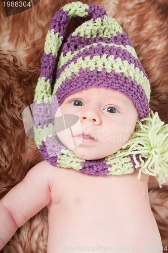 Image of Newborn baby in striped cap