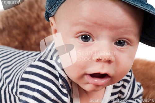 Image of Newborn baby in striped clothes