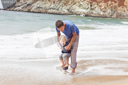 Image of father and son at the beach