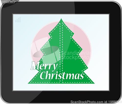 Image of new year and christmas tree on tablet pc