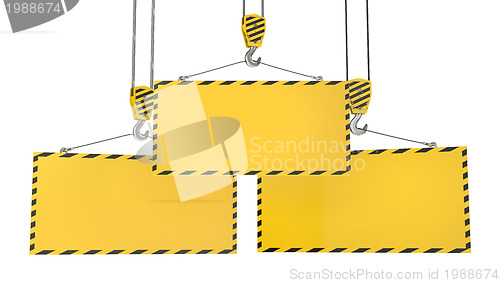 Image of Three crane hooks with blank yellow plates