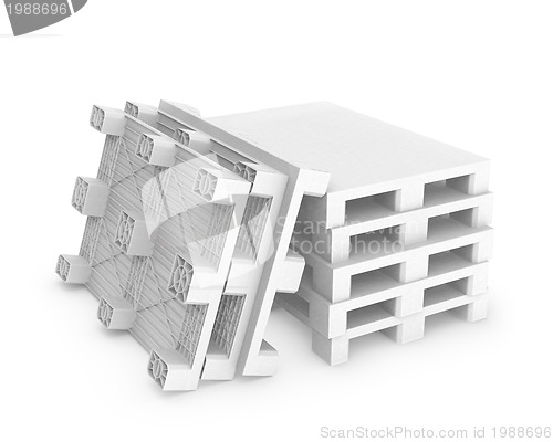 Image of Stack of white plastic pallets