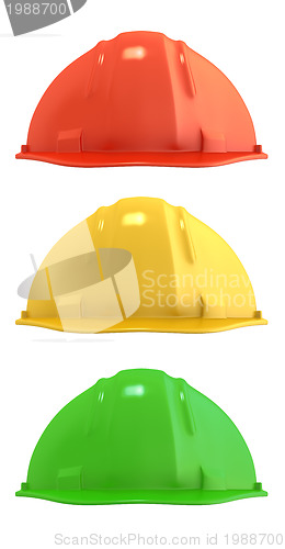 Image of Three construction helmets colored as traffic light