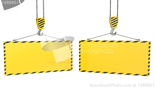 Image of Two crane hooks with blank yellow plates