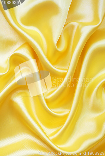 Image of Smooth elegant golden silk as background 