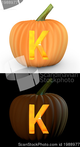 Image of K letter carved on pumpkin jack lantern