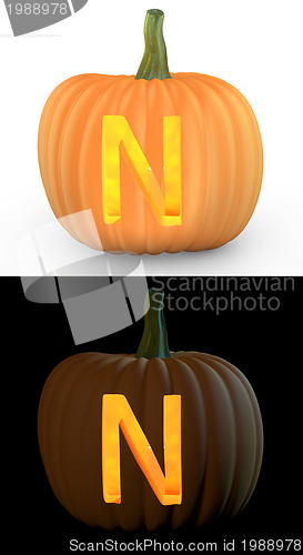 Image of N letter carved on pumpkin jack lantern