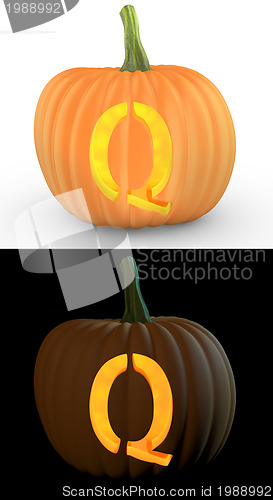 Image of Q letter carved on pumpkin jack lantern