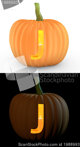 Image of J letter carved on pumpkin jack lantern