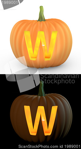 Image of W letter carved on pumpkin jack lantern