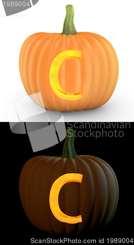 Image of C letter carved on pumpkin jack lantern