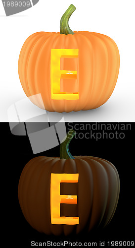 Image of E letter carved on pumpkin jack lantern 