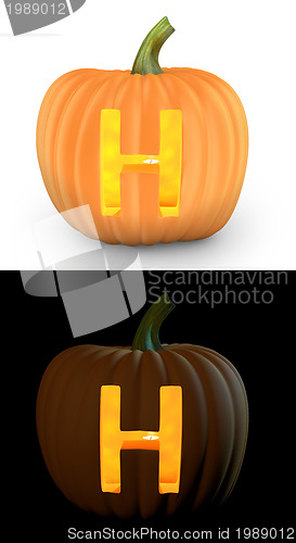 Image of H letter carved on pumpkin jack lantern