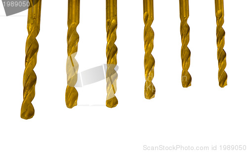 Image of Various size golden drill bits isolated on white 