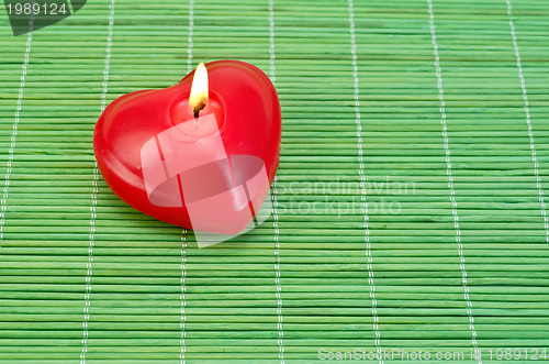 Image of Heart of candles on bamboo