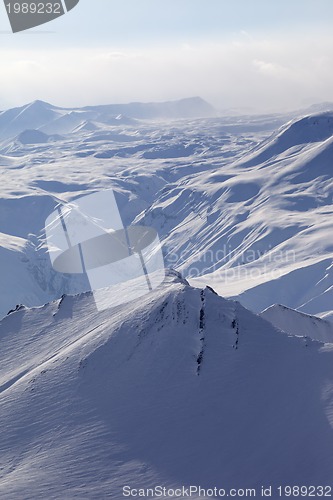 Image of Snowy mountains in haze