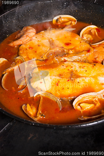 Image of Cooking hake in sauce