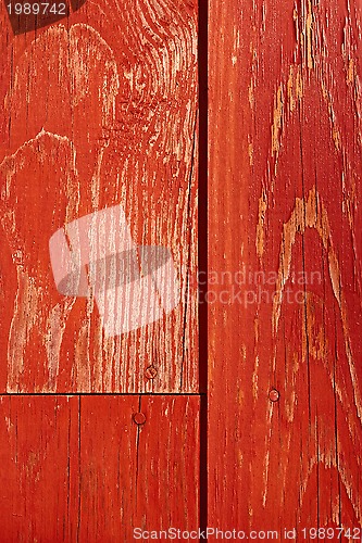 Image of Painted in red old wooden shield