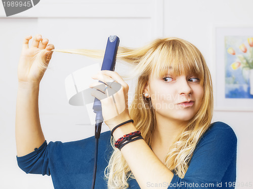 Image of teenager smooting her hair