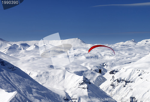 Image of Sky gliding in snowy mountains