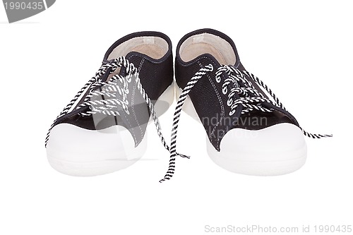 Image of pair of simple gumshoes ( sneakers )