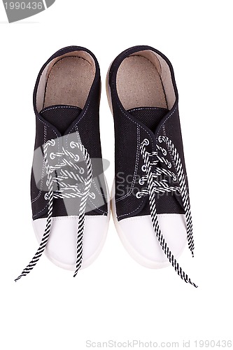 Image of pair of simple gumshoes ( sneakers )