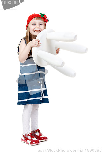 Image of little girl with a white chair in the hands of