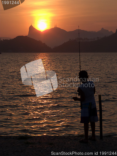 Image of Kid fishing on the sunset in Rio de Janeiro
