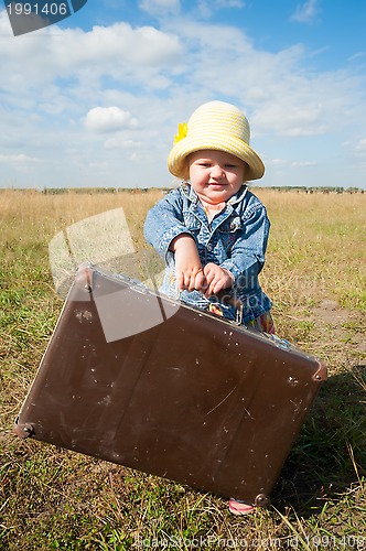 Image of lonely girl with suitcase